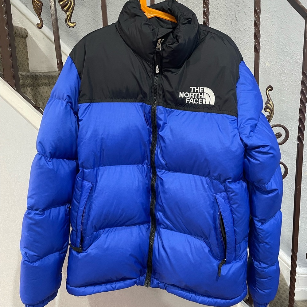 The North Face Blue and Black Puffer Jacket.